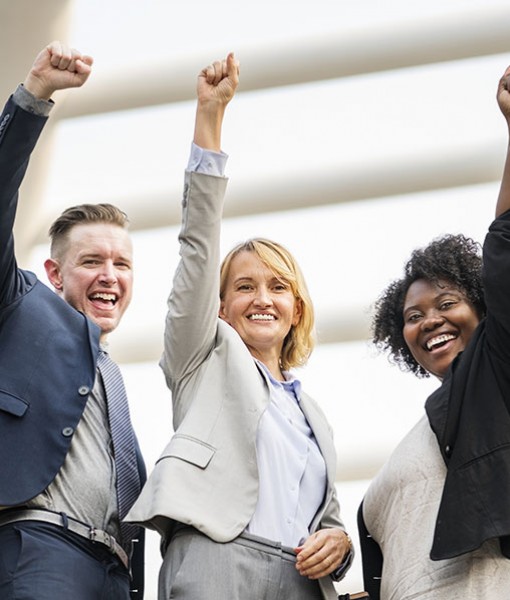 Smiling people with raised arms